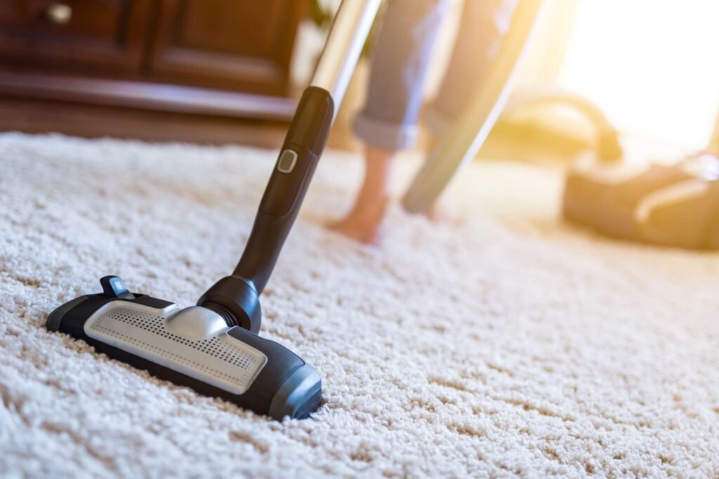 Vacuuming carpet as part of a deep cleaning service