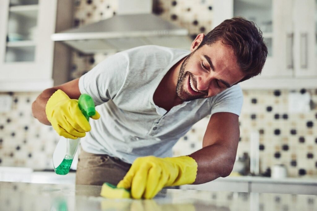Scrubbing kitchen counter during a deep cleaning session